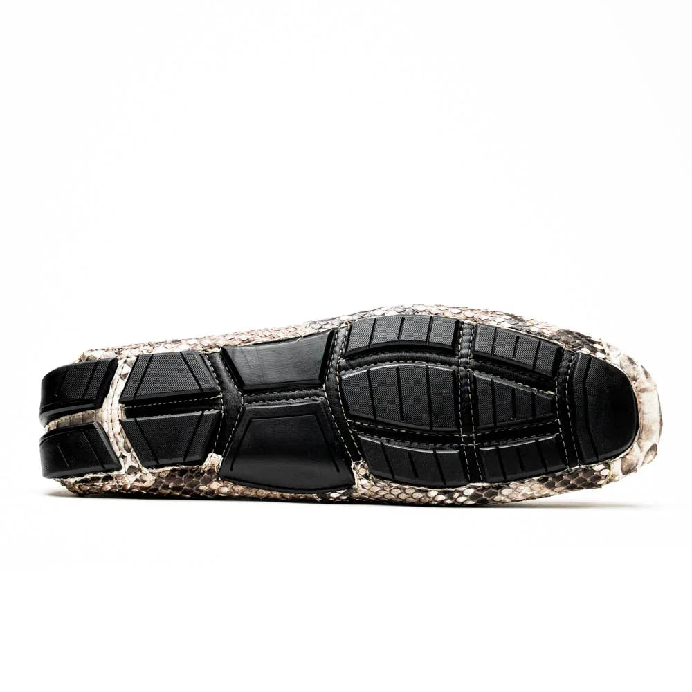 Side angle of genuine python leather driving shoe with flexible sole and distinctive natural pattern.