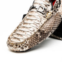Detail focus on the vamp and side of the python leather loafer showing exotic texture and stitching.