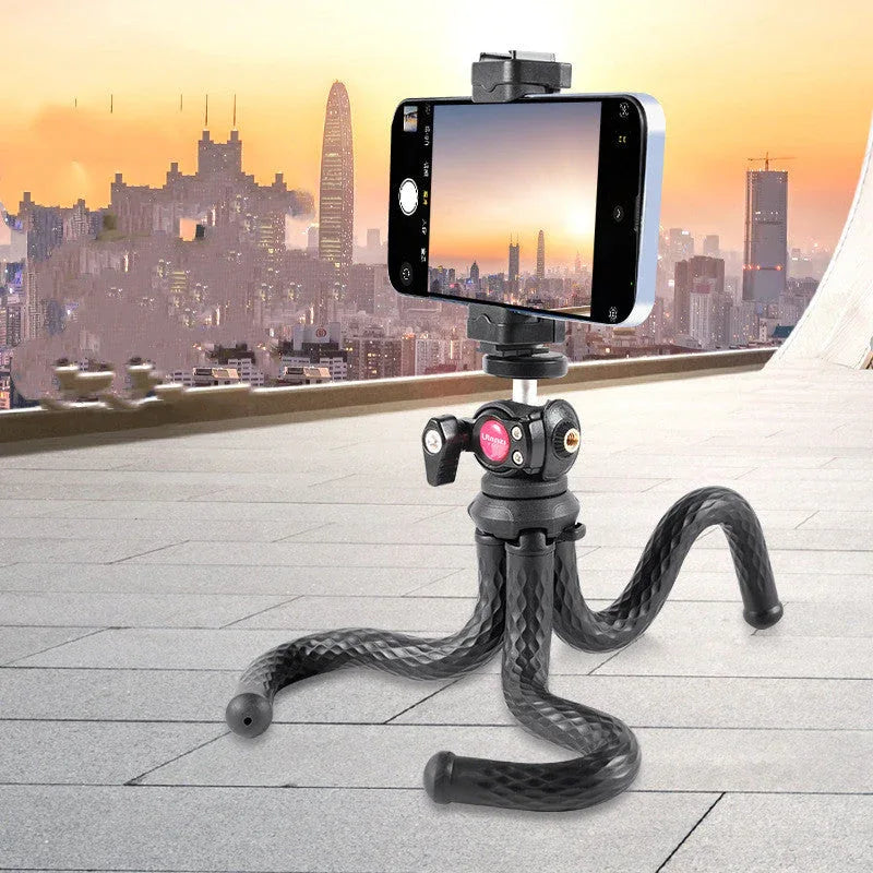 Black octopus gimbal tripod set with phone clip and tripod extended on white background.