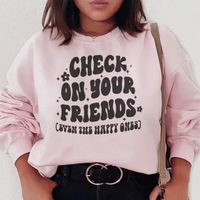 Light pink sweatshirt with 'Check On Your Friends Even' text, soft fleece lining, small size.