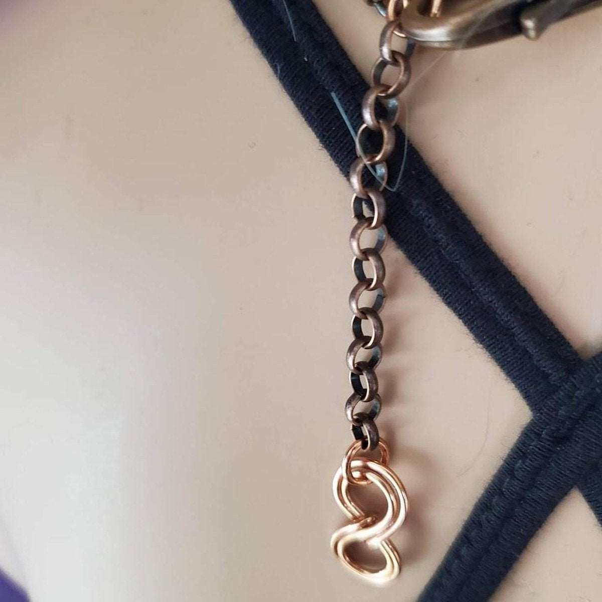 Artisan copper wire sculpted heart pendant with turquoise and crystal beads displayed on leather necklace.