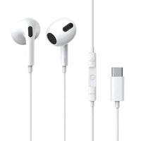 Close-up of white Type-C wired headset earplugs with cable on a light surface.