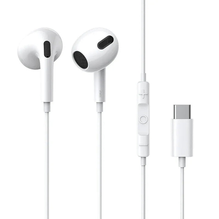 Close-up of white Type-C wired headset earplugs with cable on a light surface.