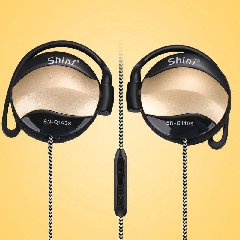 Ear hook headphones placed neatly with 3.5mm plug and cable visible on white surface.