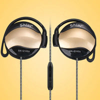 Ear hook headphones placed neatly with 3.5mm plug and cable visible on white surface.