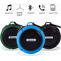 Top view of mini portable waterproof Bluetooth speaker showing round shape and suction cup