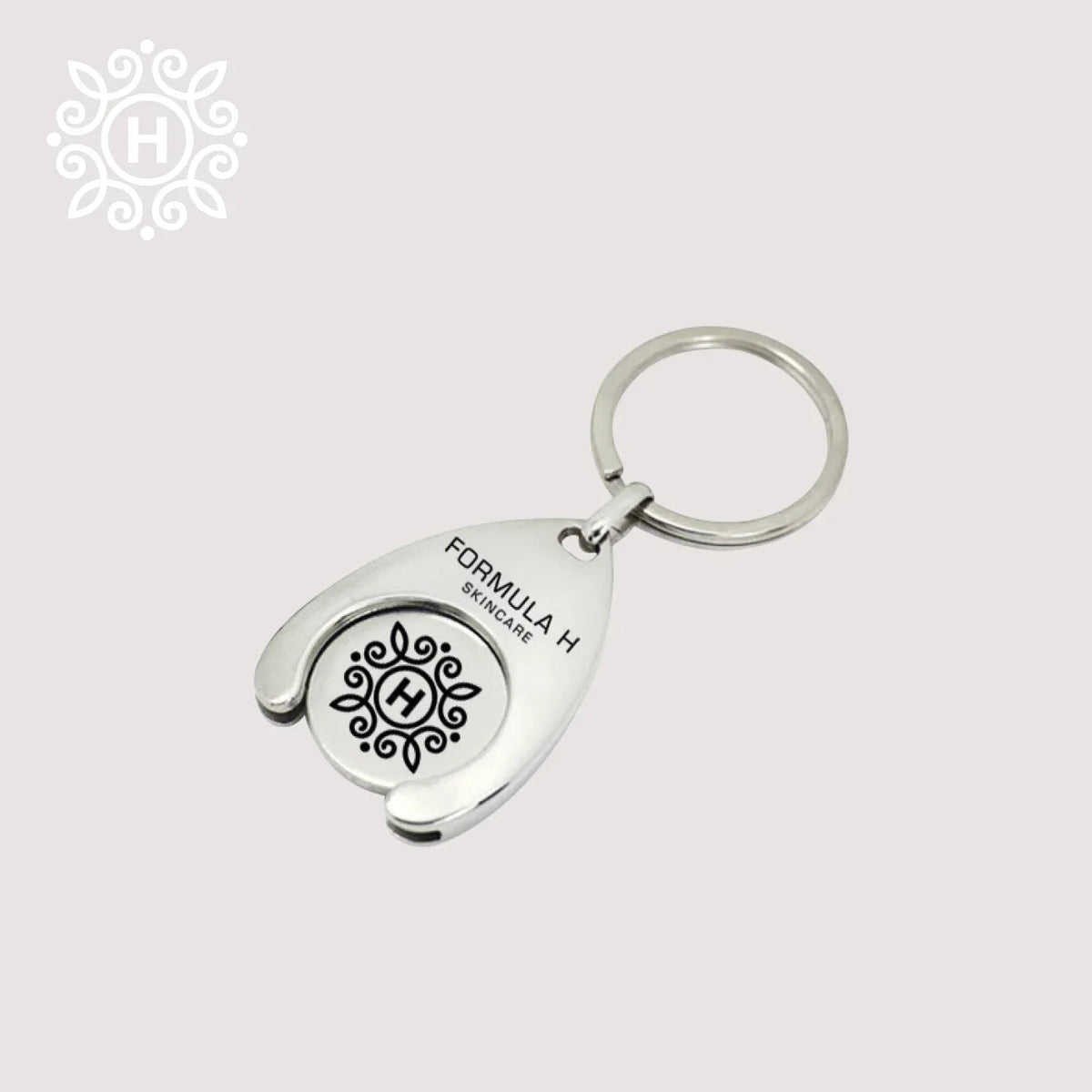 Stainless steel keychain featuring a wagon coin with original Formula H engraving