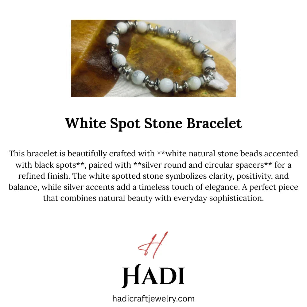 Close-up of Dalmatian Jasper beads with silver spacers showing creamy white stones with black spots