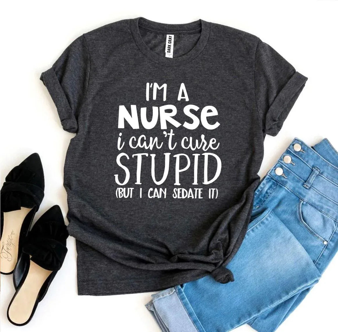 Close-up of T-shirt fabric showing soft cotton texture and printed nurse quote.