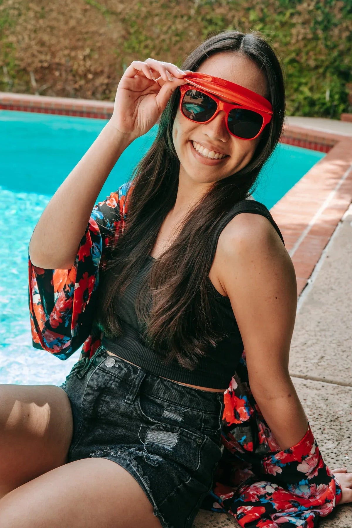 Top view of black Flipside Sunglasses showing hinge and visor alignment detail.