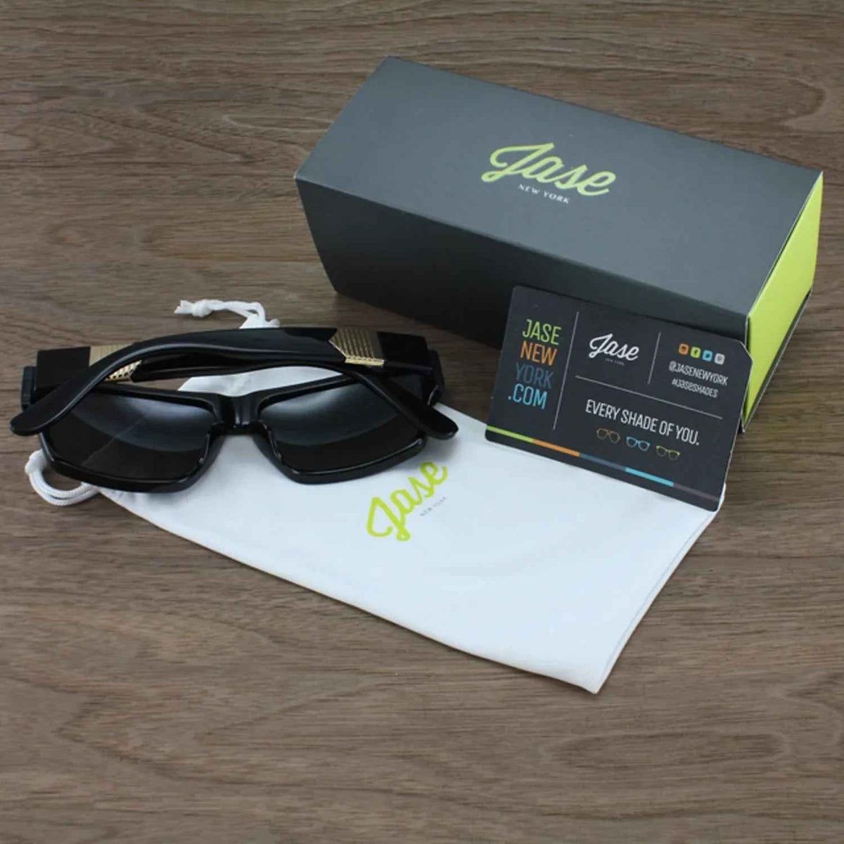 Black Jase New York Carter sunglasses on white background showing square frame and metal pyramid accents.