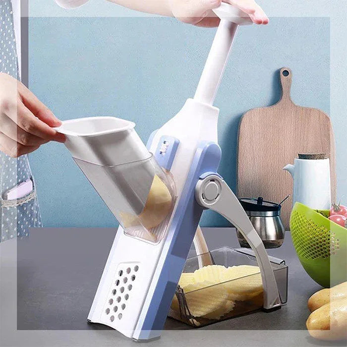 Close-up of chopper slicing vegetables with adjustable thickness setting on a kitchen surface.
