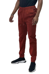 Front view of solid jogger pants with elastic waistband and standard pockets on a plain background.