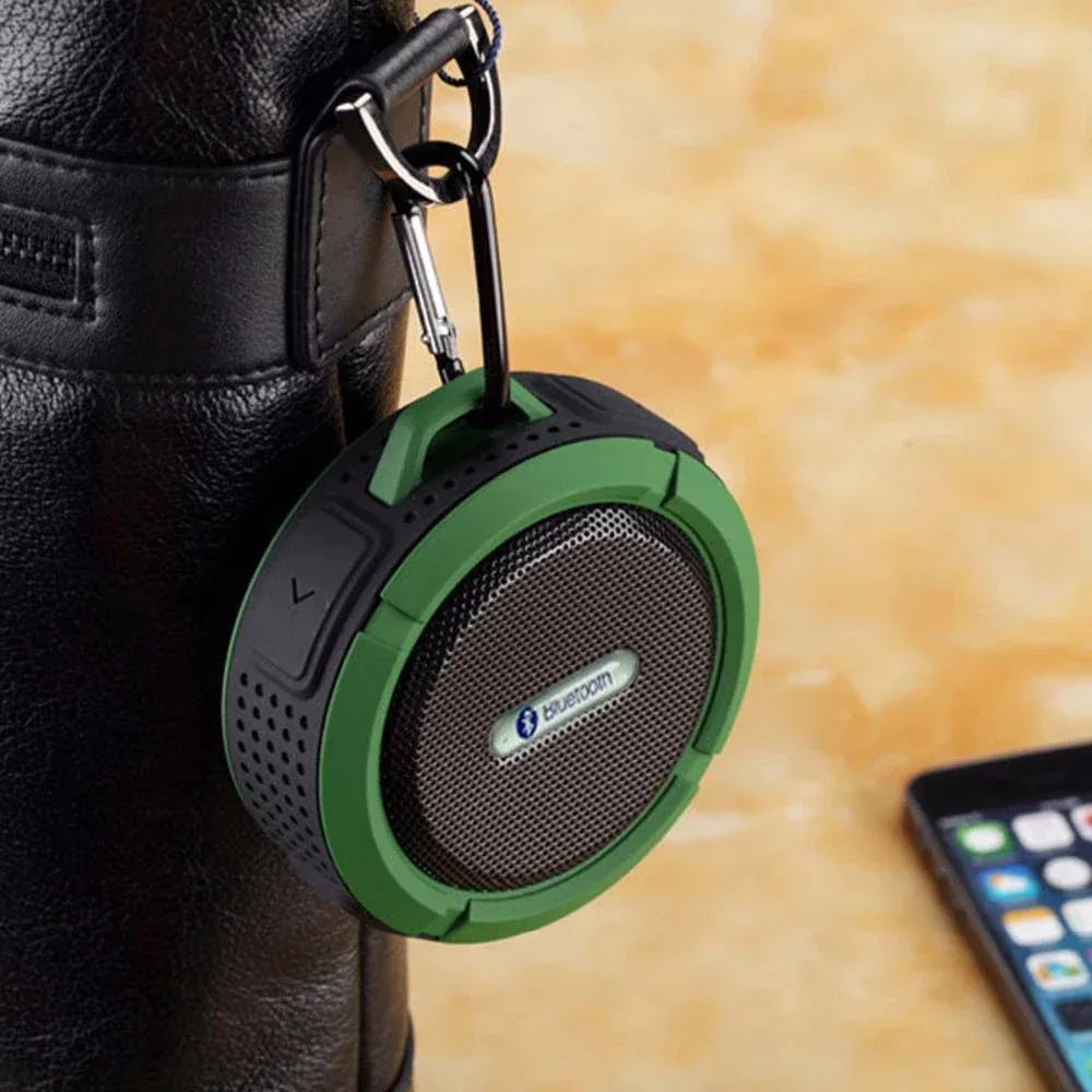 Side profile of compact waterproof Bluetooth speaker highlighting the suction cup attachment