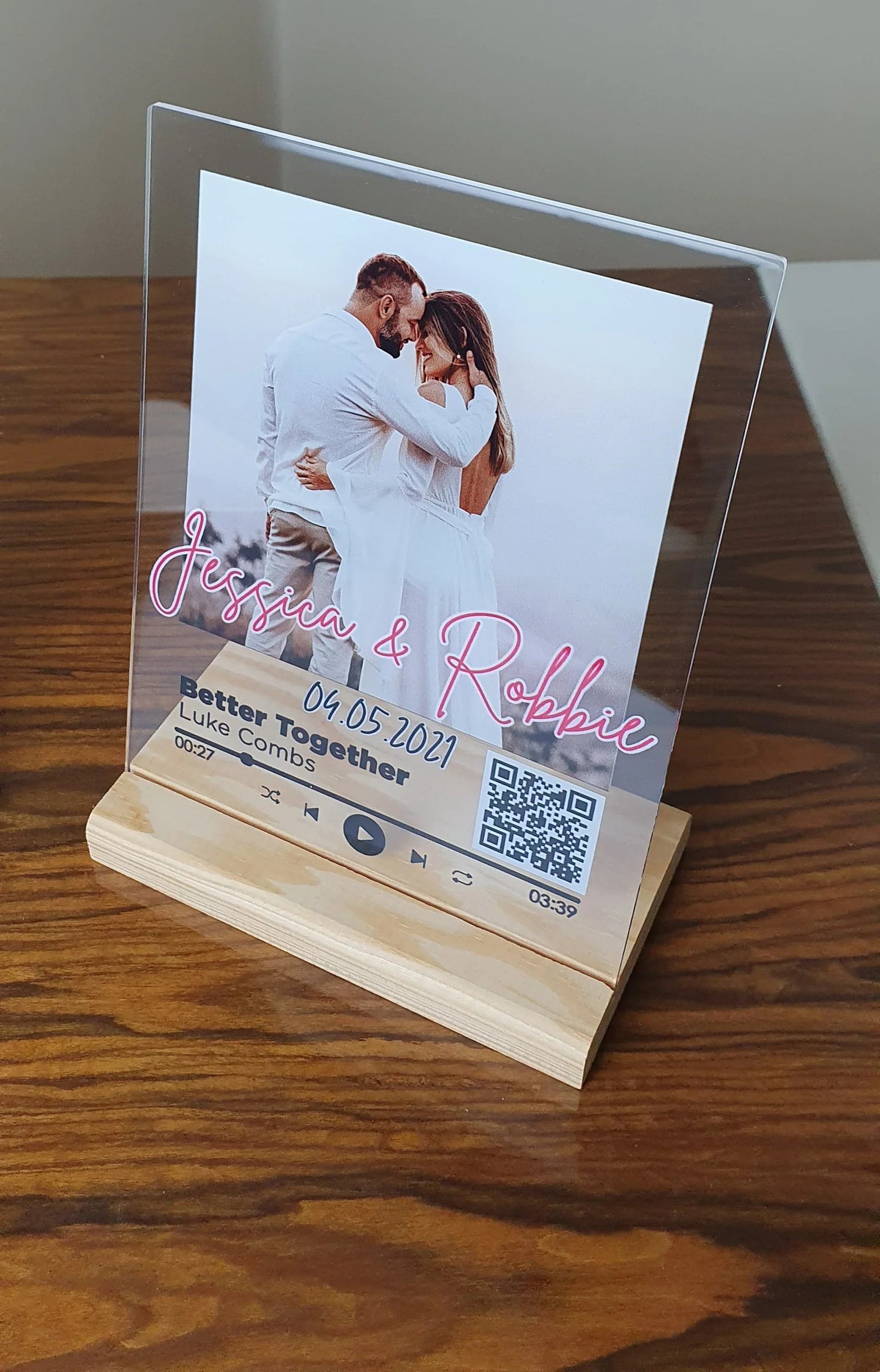 Custom acrylic music plaque illuminated with LED light showcasing personalized song and photo.