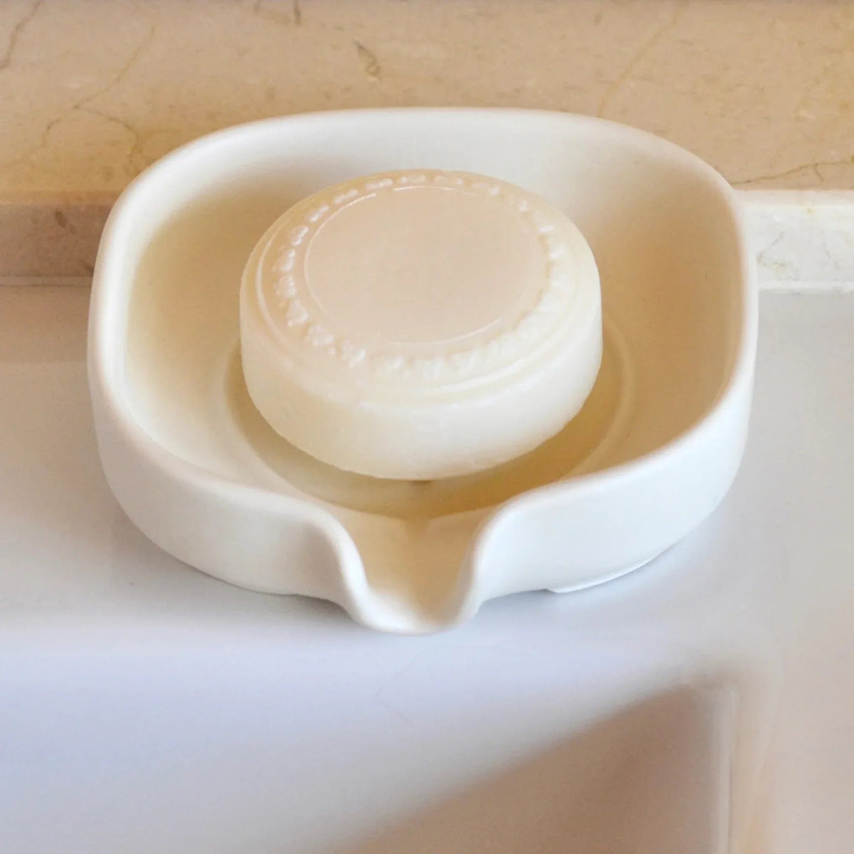 Soap dish empty, displaying self-draining channel design to keep soap dry.