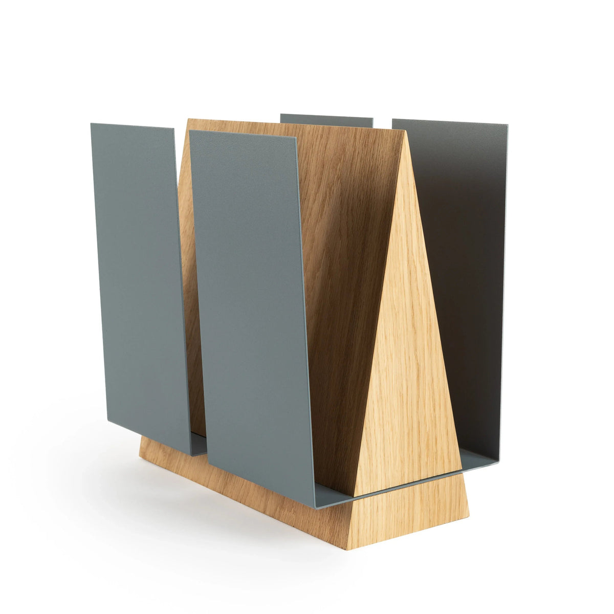 Close-up of the WINGS magazine rack highlighting powder-coated black metal wings and oak wood base.