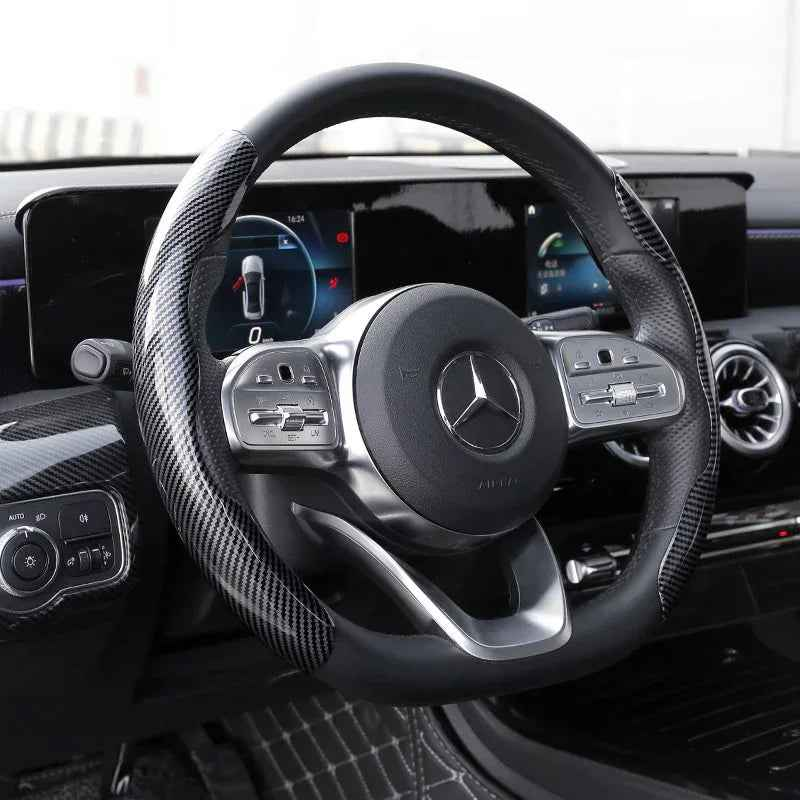 1 Pair Carbon Fiber Universal Car Steering Wheel Cover with textured anti-skid grip fitted on a car wheel