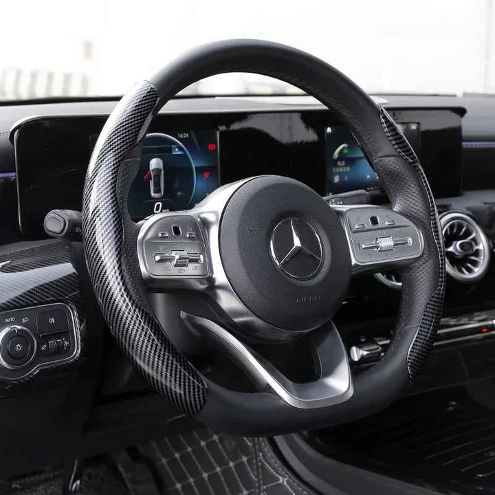 1 Pair Carbon Fiber Universal Car Steering Wheel Cover with textured anti-skid grip fitted on a car wheel