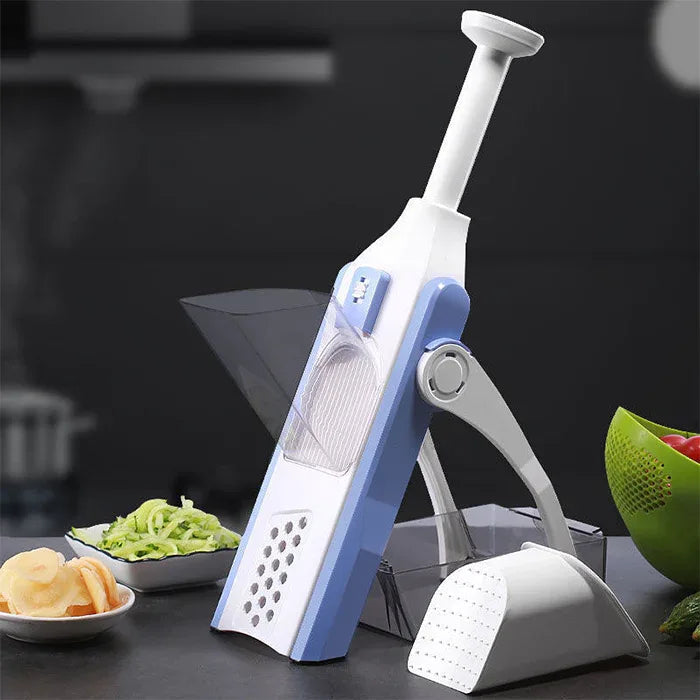 Chopped vegetables in various shapes displayed next to the chopper on a cutting board.