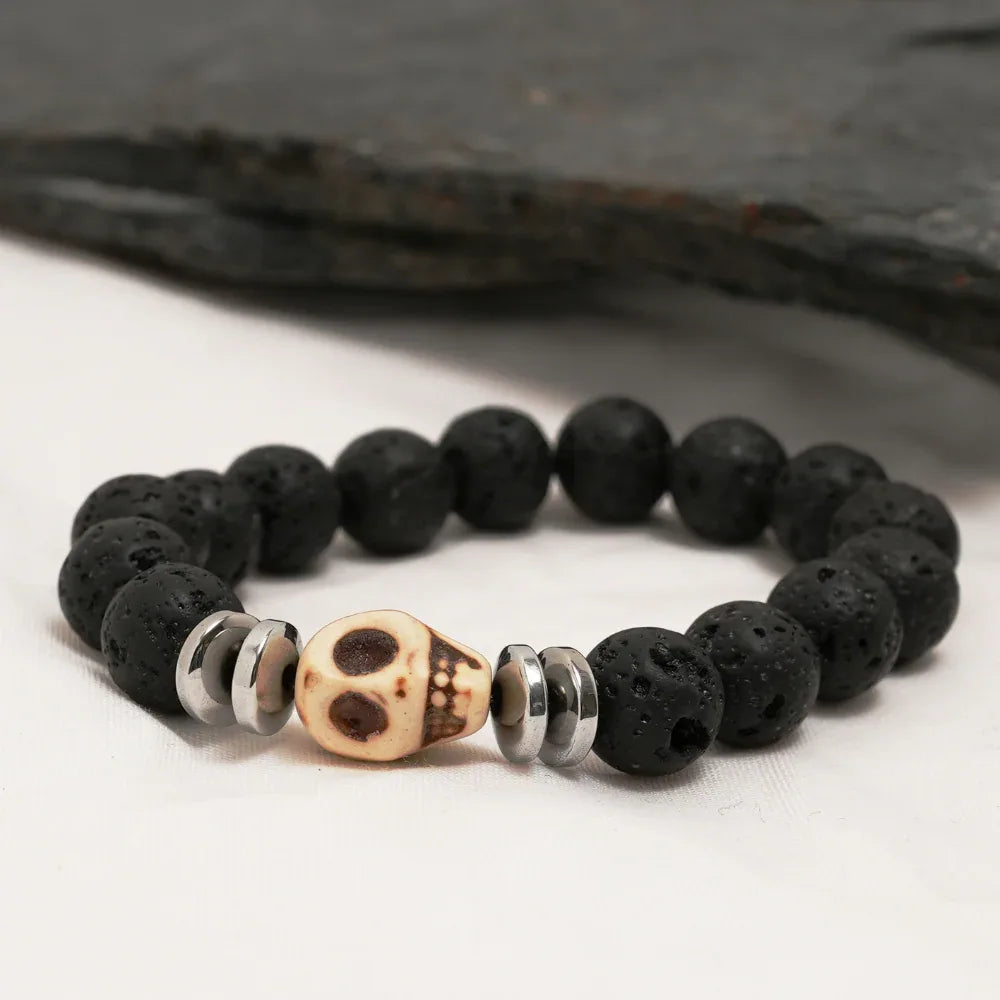 Skull bracelet coiled showing silver skull bead accented by black lava stone beads