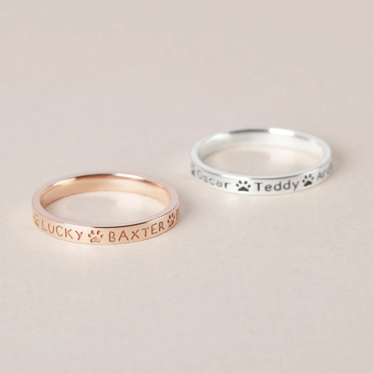 Close-up shot of a person wearing the custom pet names ring on their finger.