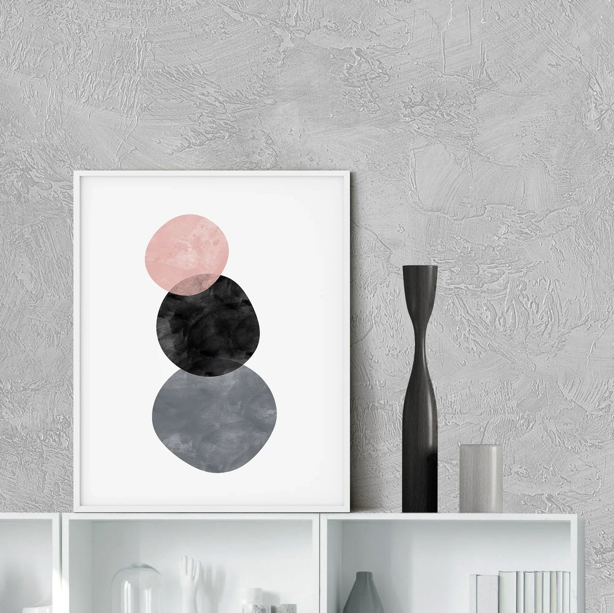 Abstract circles art print displayed on a wall in a minimalist room setting, frame not included.