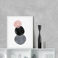 Abstract circles art print displayed on a wall in a minimalist room setting, frame not included.