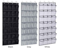 White hanging organizer with 28 clear pockets for shoes and accessories, draped over a door in a tidy room.