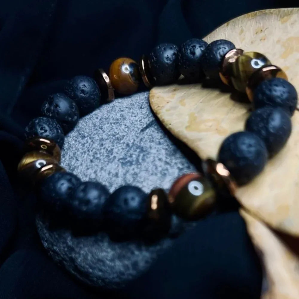 Side view of men's Black Lava and Tiger Eye stone bracelet featuring copper spacer beads.