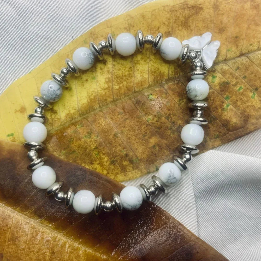 Circular Dalmatian Jasper stretch bracelet with distinctive black spotted beads and silver spacers