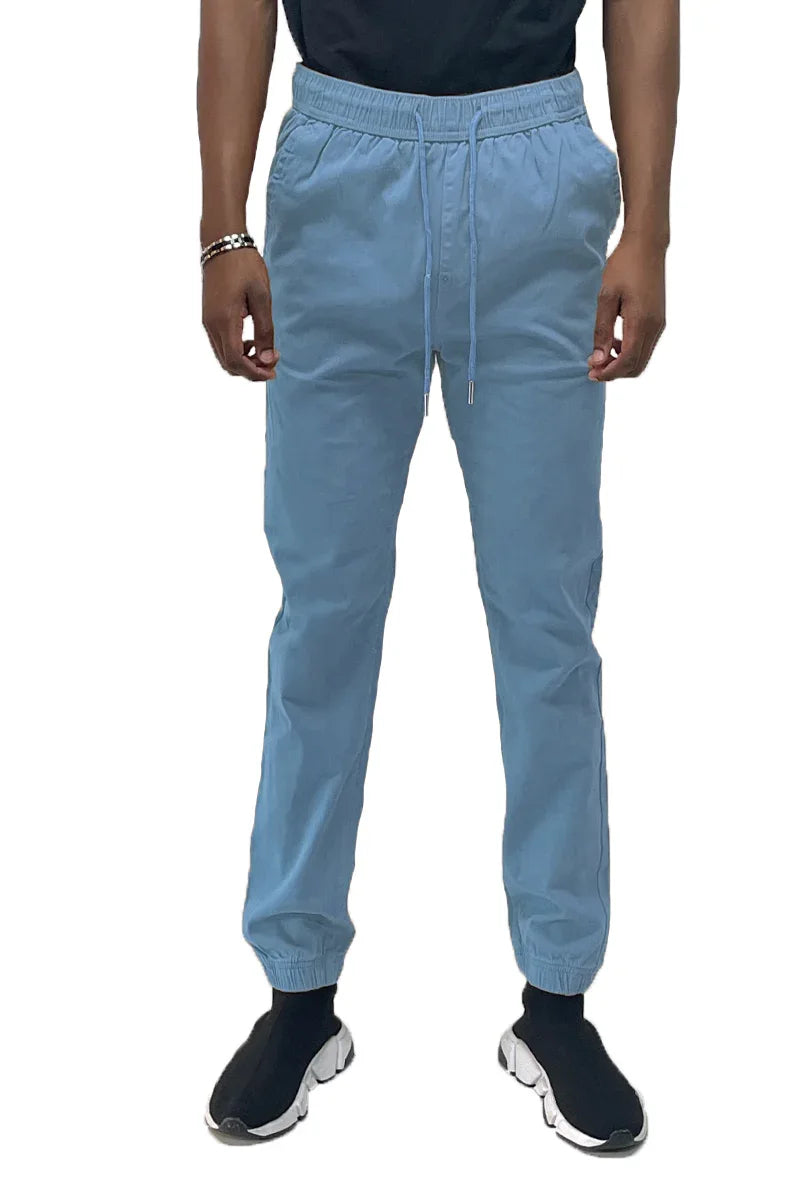 Back view of solid jogger pants showing two back pockets and elastic ankle cuffs.