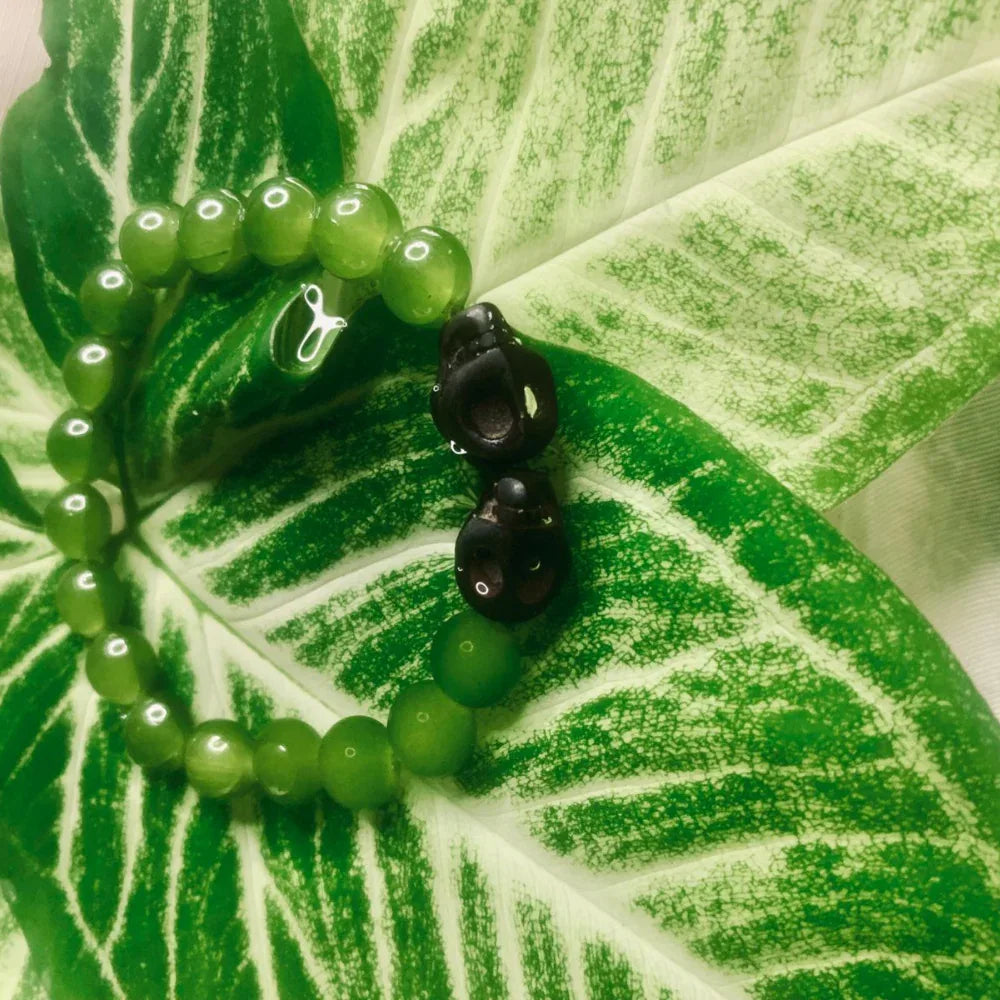 Handcrafted boho stretch bracelet made with natural green aventurine beads, shown in close view.
