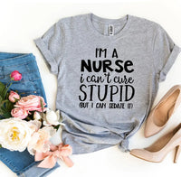 Close-up of white bold text printed on black T-shirt saying 'I’m a Nurse I Can’t Cure Stupid'.