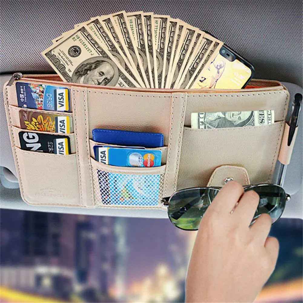 Close-up of car sun visor organizer with zippered pocket and sunglass clip attached to car visor