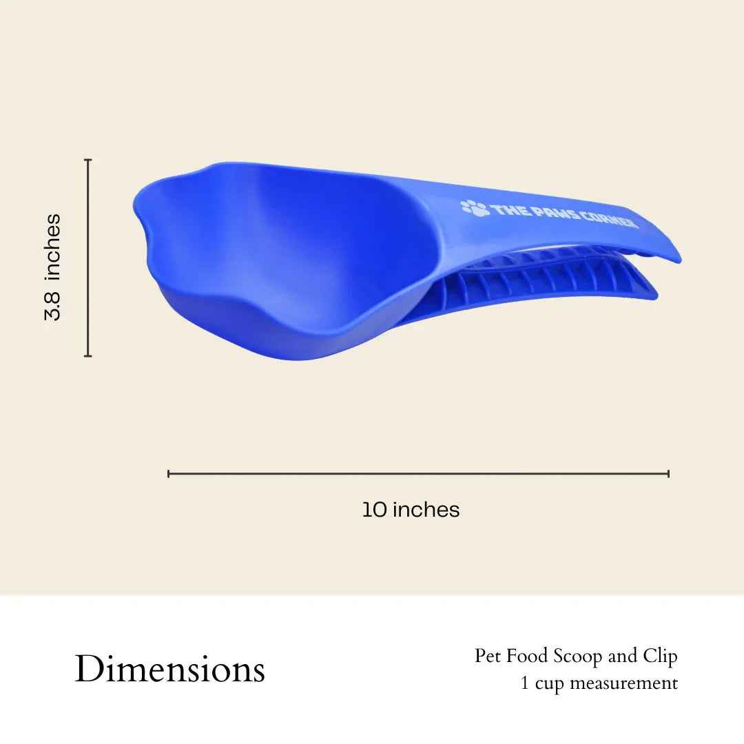A paw-shaped pet food scoop with a clip, holding one cup of kibble on a white background.