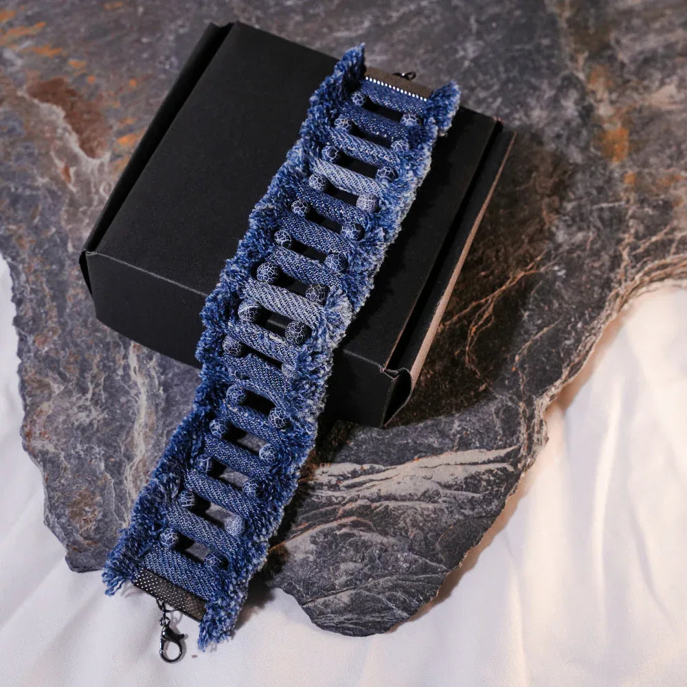 Boho tribal denim necklace paired with matching bracelet featuring textured fabric and stone accents.