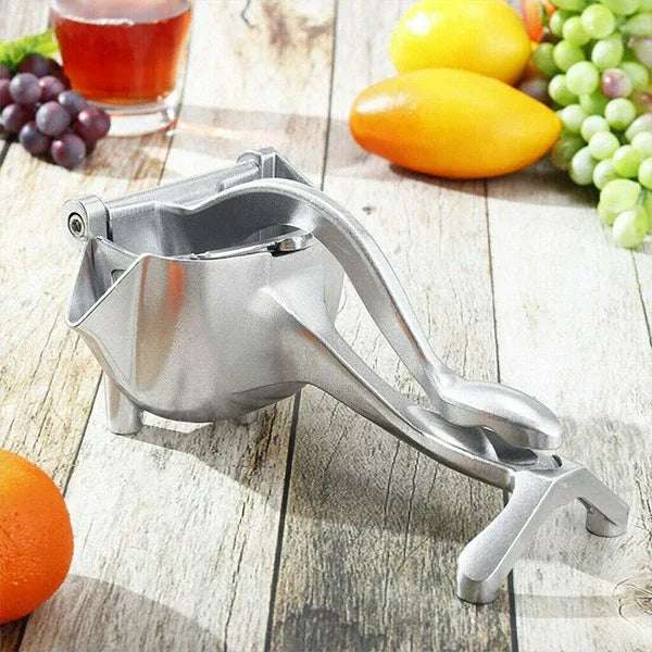 JuicyStar manual juicer with pressed orange half, demonstrating juice extraction process.