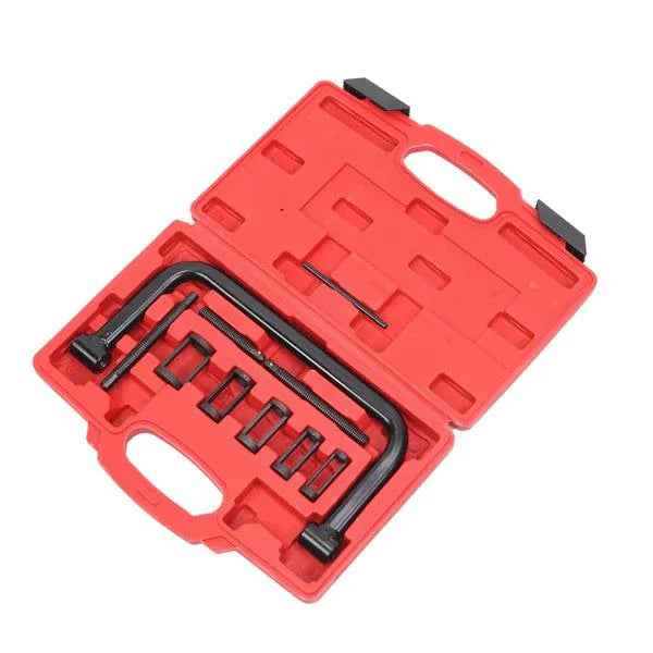 Set of 10 metal valve spring compressor tools in various sizes arranged neatly on a white background.