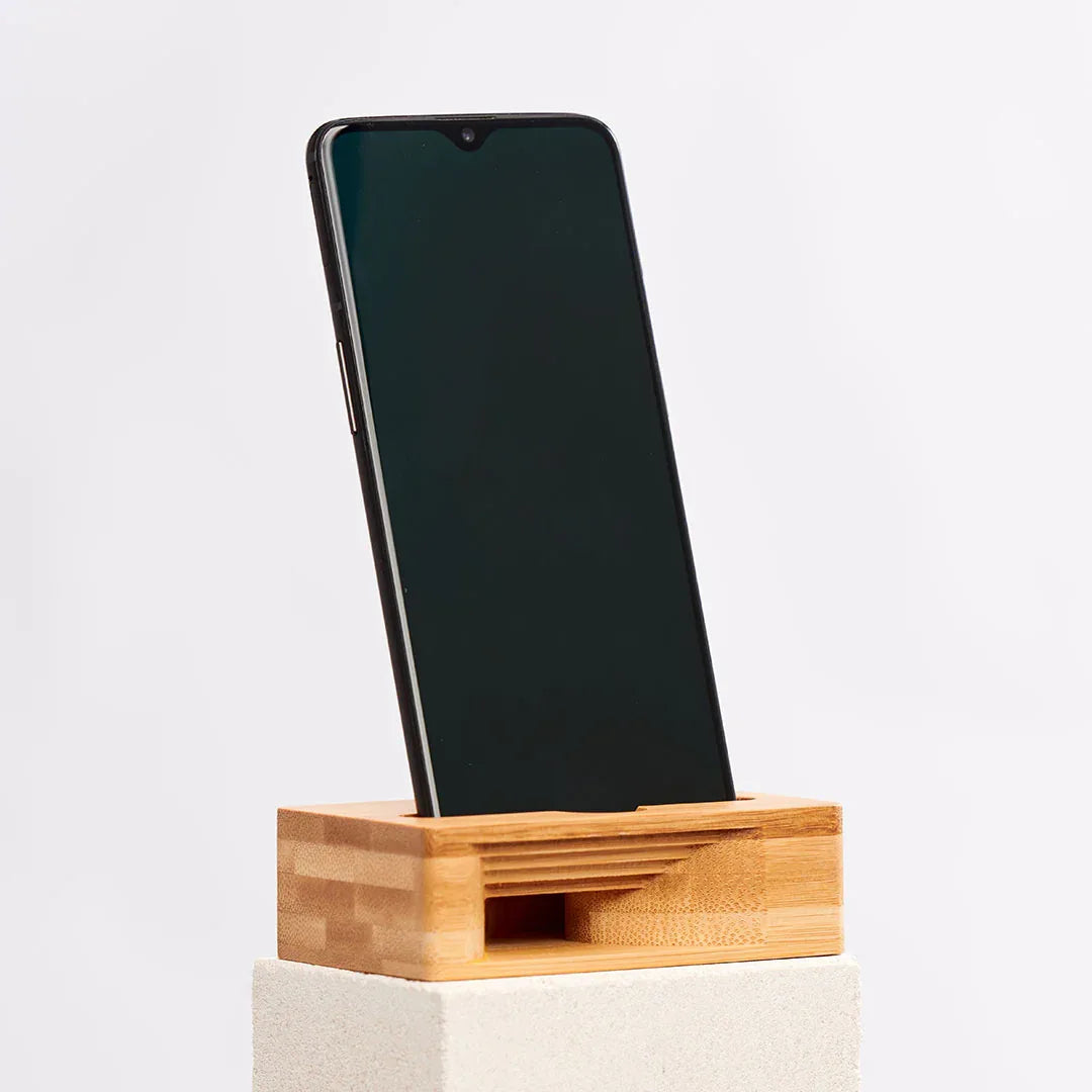 Wooden phone stand shaped like a woodland mouse that also amplifies sound, made of bamboo.