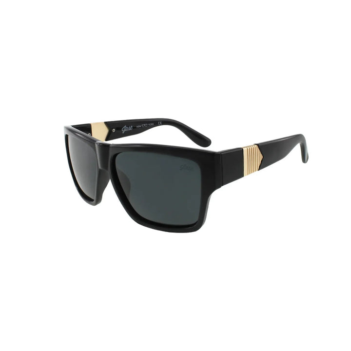 Close-up of black Jase New York Carter sunglasses showcasing pyramid-like metal obelisk detail on frame sides.