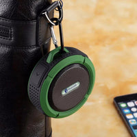 Side profile of compact waterproof Bluetooth speaker highlighting the suction cup attachment