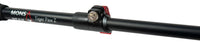 Close-up of trekking pole snap-click compression lock and grip handle in black and cork.