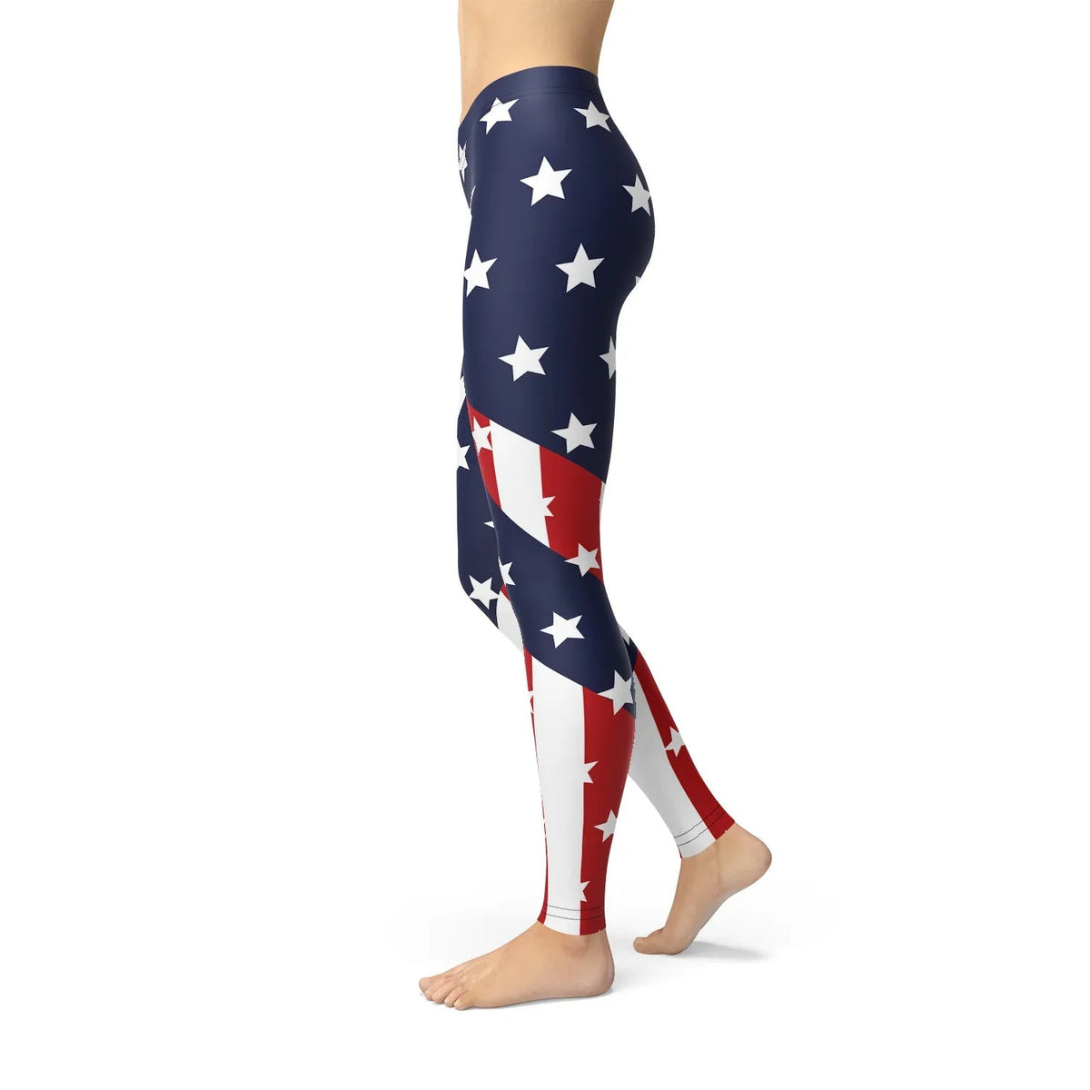 Woman in American flag leggings paired with sporty shoes, standing on pavement