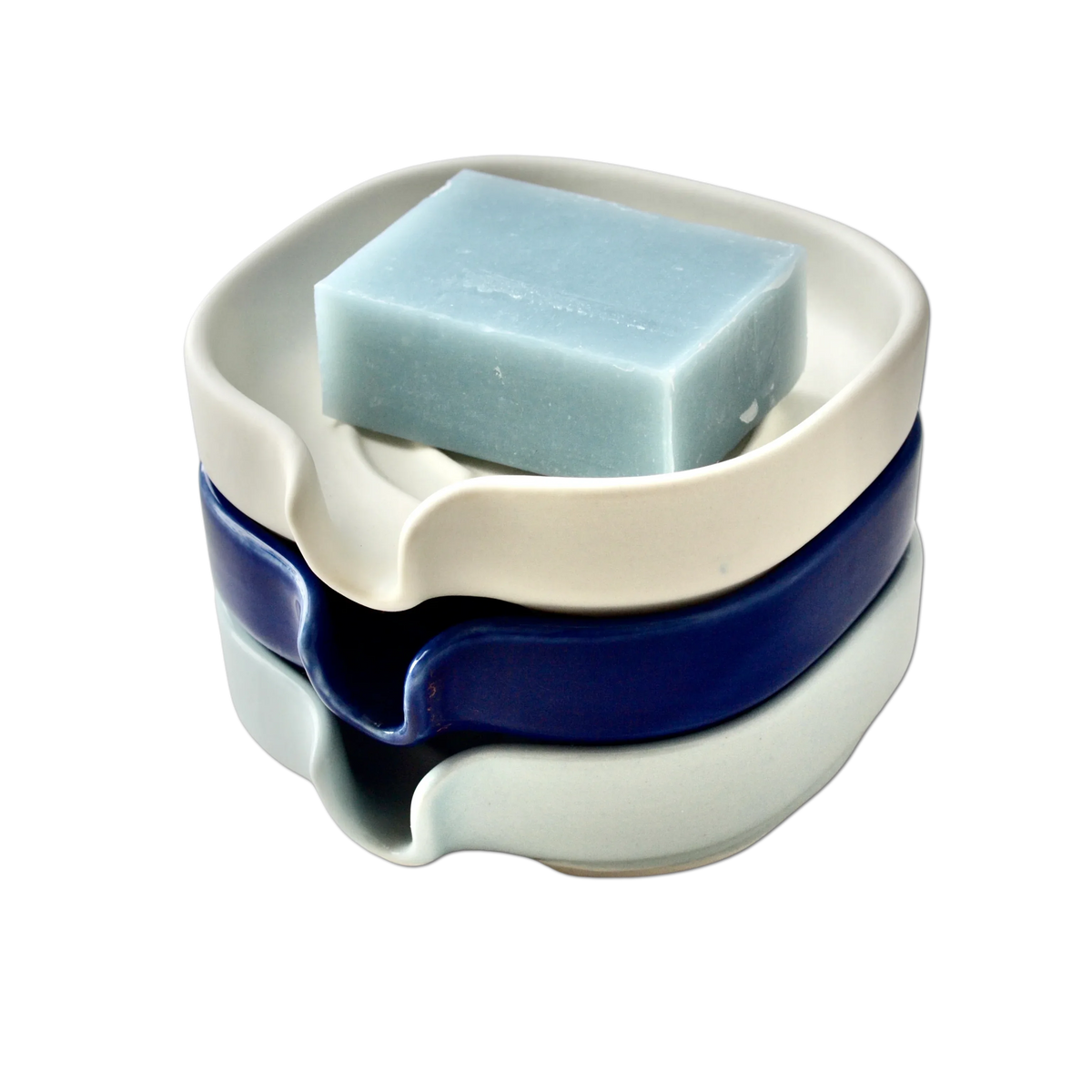 Digital illustration showing cross-section of soap dish draining water away.