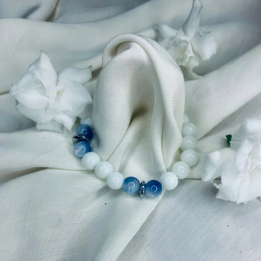 Healing bracelet featuring alternating blue lace agate and white howlite stones with silver accents.