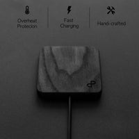 Side view of handcrafted wooden wireless charger showing its slim profile and smooth edges