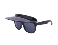 Close-up of Flipside Sunglasses showing black frame and clear vertical visor in upright position.