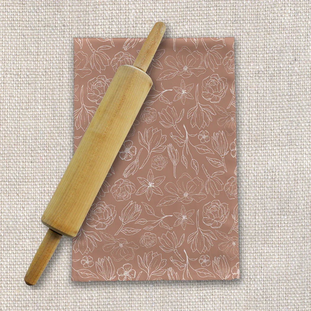 Close-up of Copper Magnolia Tea Towel showing textured cotton twill fabric and copper magnolia print.