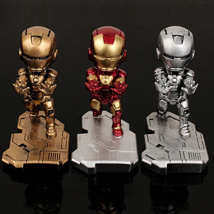 Iron Man phone stand beside a smartphone and desktop items illustrating desktop organization.